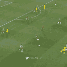 a group of soccer players on a field with the twitter username @imaanbaz visible