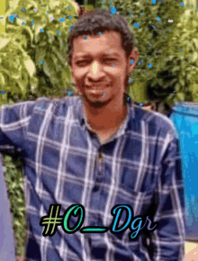 a man in a plaid shirt has the hashtag # 0_dgr on his chest
