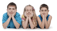 three children laying on the floor with their hands on their chins