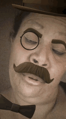 a man with a hat and glasses and a mustache