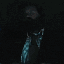a man with a beard says i 'm a detective while pointing at his head