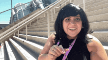 a woman with a lanyard around her neck that says ' sd ' on it