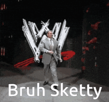 a man in a suit and tie dancing in front of a w logo