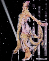 a woman in a pink dress is dancing on a stage with a t4yce tumblr logo in the corner