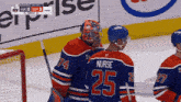 a hockey player with the number 25 on the back of his jersey