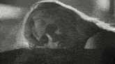 a black and white photo of a woman with a scary face