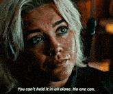 a close up of a woman 's face with the words you can 't hold it in all alone