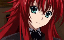 a close up of a red haired anime girl with blue eyes and red hair .