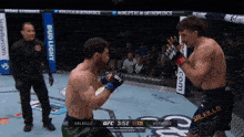 two men are fighting in a boxing ring with a bud light advertisement behind them