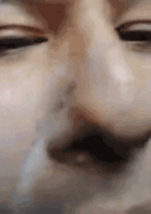 a close up of a person 's nose and mouth