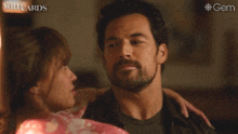 a man and a woman are hugging and the man says " sure you did "