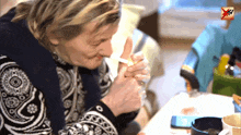 a woman lighting a cigarette with a mtv logo in the corner