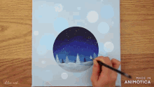 a person is painting a snowy landscape on a canvas made by animatica