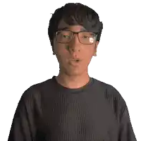 a man wearing glasses and a black shirt with the word muhammad on it