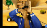 a man in a blue jacket is playing a video game with a palm tree in the background