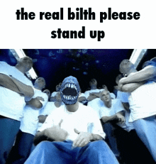 a group of people are standing around a man with a monster face and the words " the real bilth please stand up " on the bottom