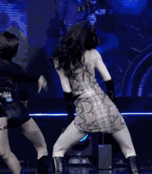 a woman in a dress is dancing on a stage