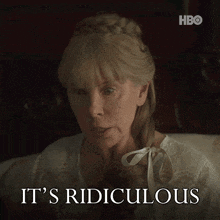 a woman sitting on a bed with the words " it 's ridiculous " above her