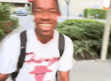 a man wearing a chicago bulls t-shirt is smiling