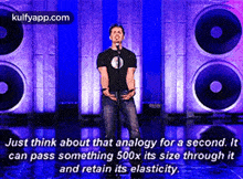 a man stands in front of a microphone with a quote about analogy