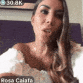 a woman in a white off the shoulder top with the name rosa caiafa on the bottom right