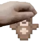 a hand is holding a piece of wood with a cross on it in a pixel art style .