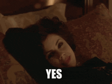 a woman laying on a bed with the words sad but true written below her