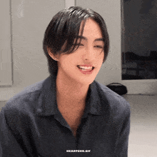 a close up of a person 's face with the words heartchu.gif written below it