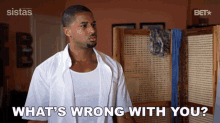 a man says what 's wrong with you in front of a screen
