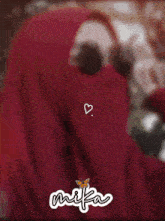 a picture of a woman wearing a hijab with the name mika on it