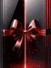 a gift box with a red bow on it .