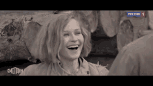 a woman is laughing in a black and white photo with the word " russia " on the bottom left