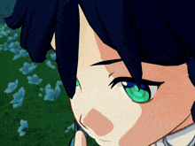 a close up of a person 's face with green eyes and black hair