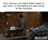 a man in a suit and tie stands in a courtroom and says " your honour my client didnt mean to say slurs "
