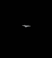 a person is holding a rocket next to a plane