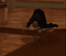 a person is doing a handstand on the floor .