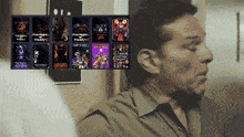 a man looks at a display of five nights at freddy 's