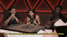 a group of people sitting around a table with the words " there should be no stigma against it not here in the bloodkeep " above them
