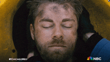 a close up of a man 's face with #chicagomed on the bottom right