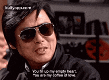 a man wearing sunglasses is saying you fill up my empty heart .