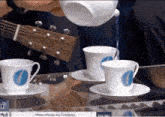 a person pouring water into a cup with the words moon music by coldplay on the bottom