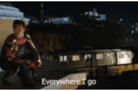 a man in a spiderman suit is kneeling down and says everywhere i go