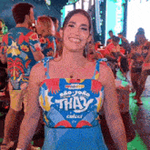 a woman wearing a blue top that says thay