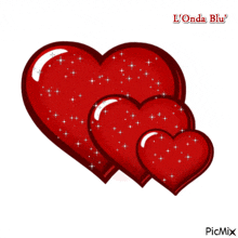 a picture of three red hearts with the words l' onda blu