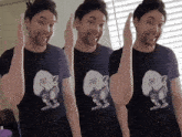 a man wearing a t-shirt with a picture of a gnome on it