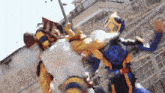 a couple of cartoon characters are fighting each other in a fenced in area .