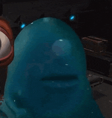 a close up of a cartoon character 's face with a blue background