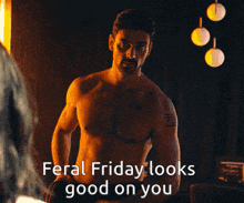 a shirtless man stands in front of a mirror with the words feral friday looks good on you above him