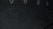 a cartoon character with a purple lantern around his neck stands in front of a group of people
