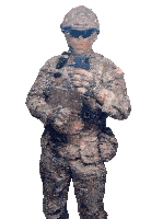 a military man taking a selfie with the name ymra on his uniform